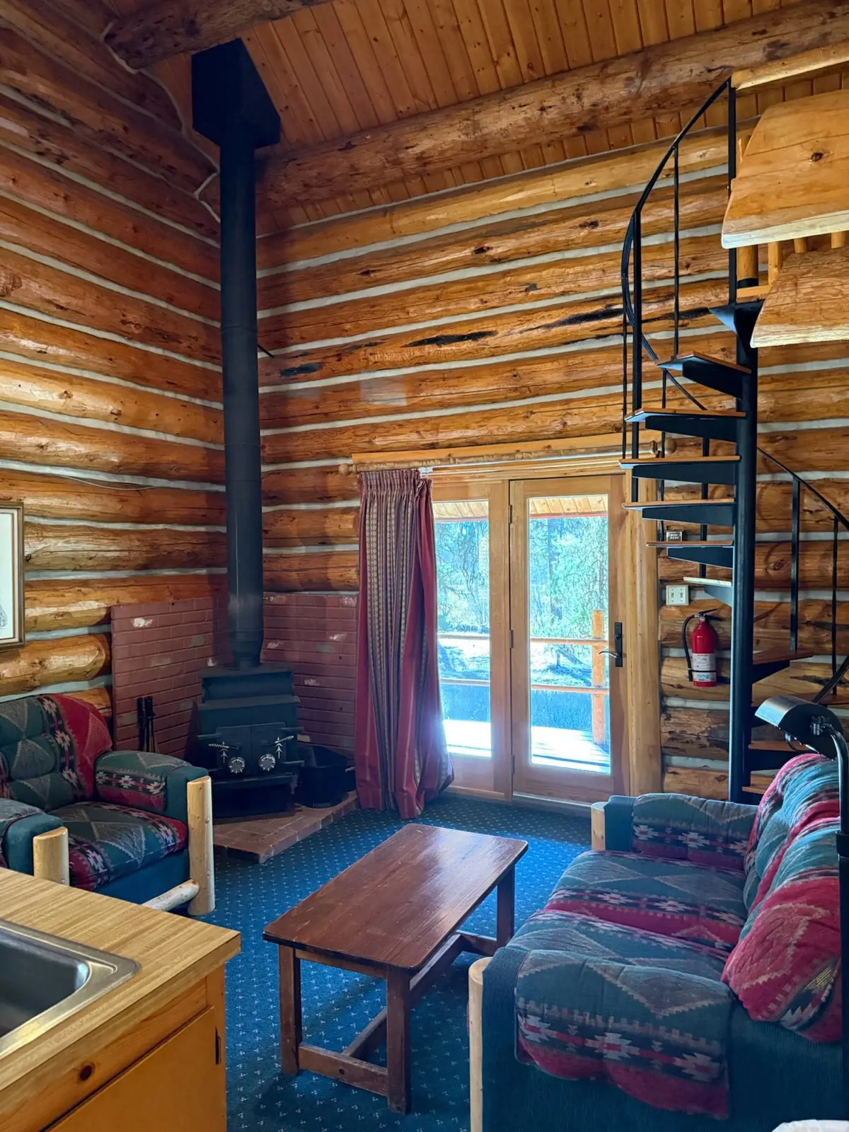 Inside the Aspen: a spiral staircase in the log interior