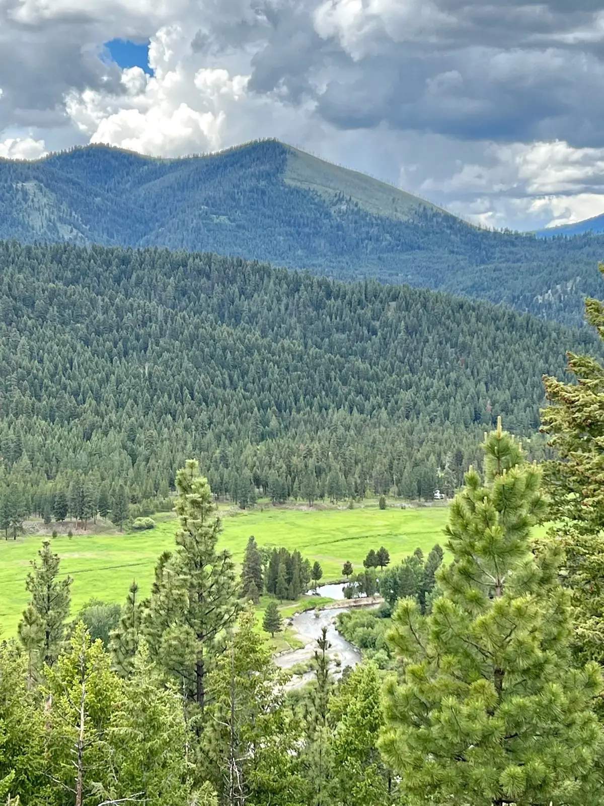 Looking down on the green valley and the river from the hills