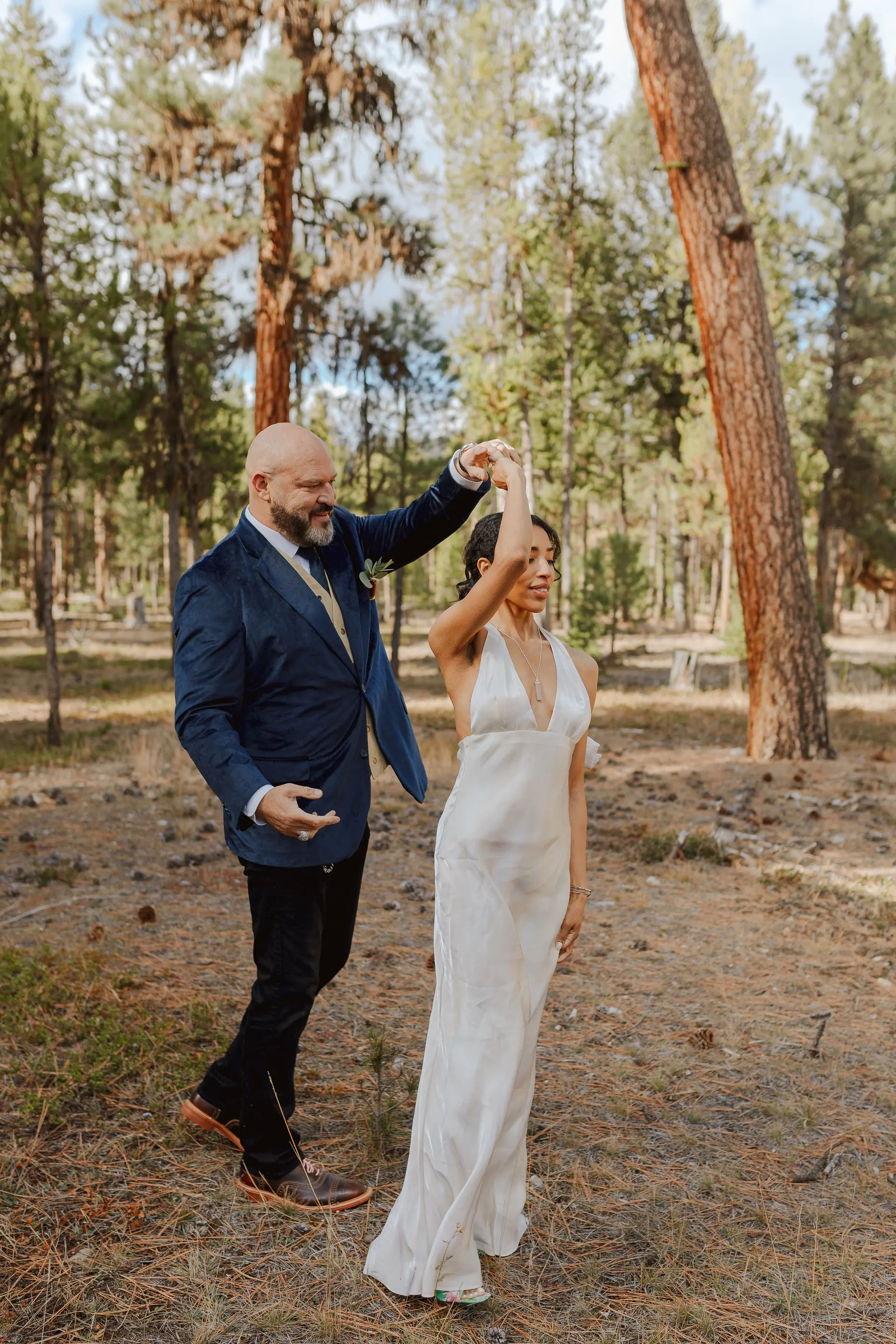 A couple dancing among the ponderosa pines at Alta Ranch