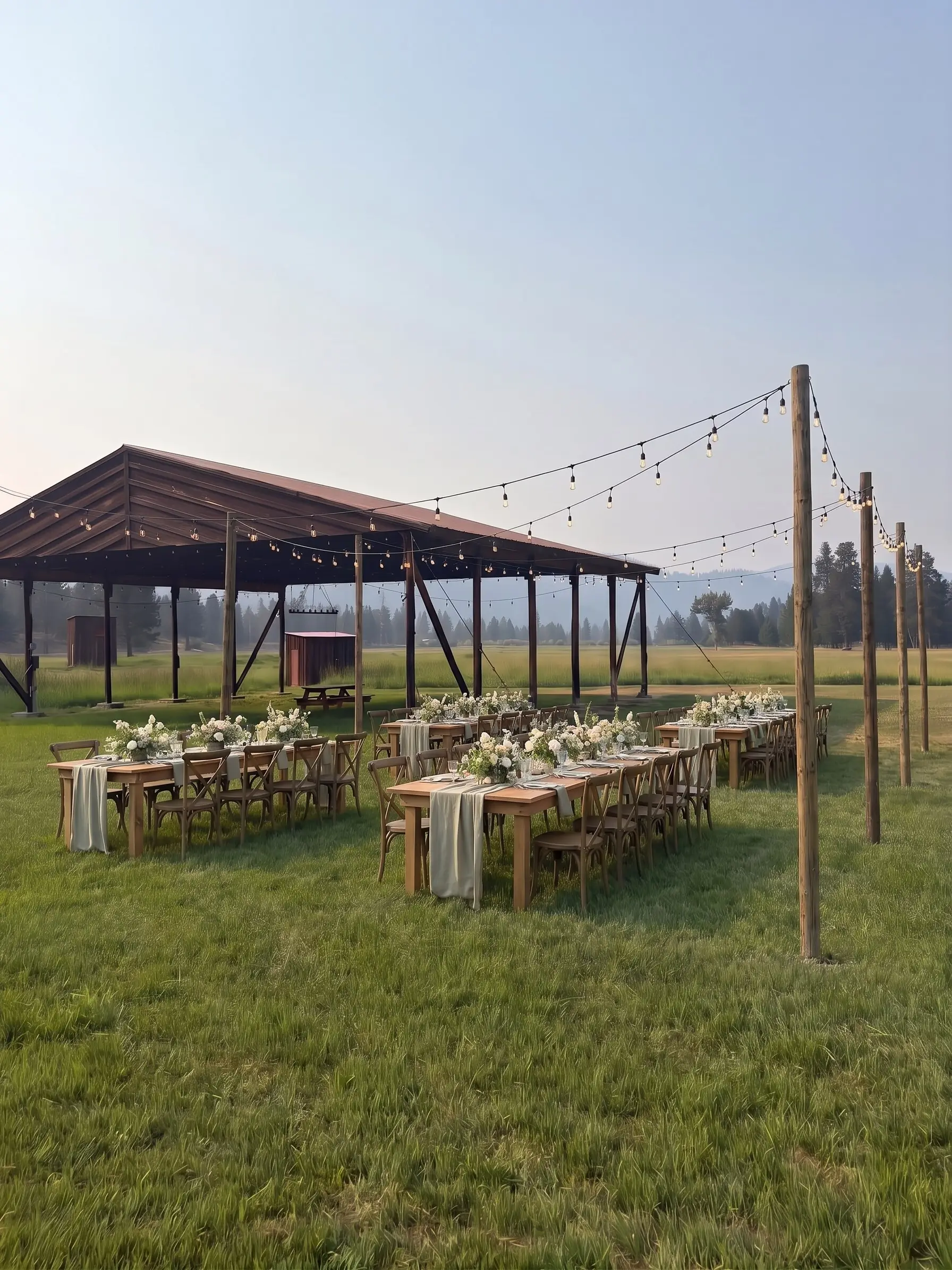 Styling idea: tables under string lights on the lawn beside the hangar